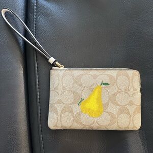 Coach Beige Wristlet with Yellow Pear Motif